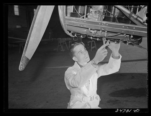 Fort Worth, Texas. Meacham Field. Student working on motor