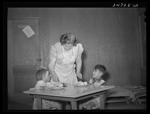Robstown, Texas. FSA (Farm Security Administration) migratory workers' camp. Migratory worker's wife serving lunch to children in nursery school