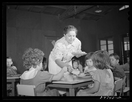 Robstown, Texas. FSA (Farm Security Administration) migratory workers' camp. Member of mothers' committee serving lunch in nursery school