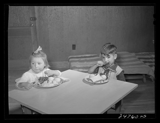 Latin-American child at lunch. Nursery school, FSA (Farm Security Administration) camp. Robstown, Texas