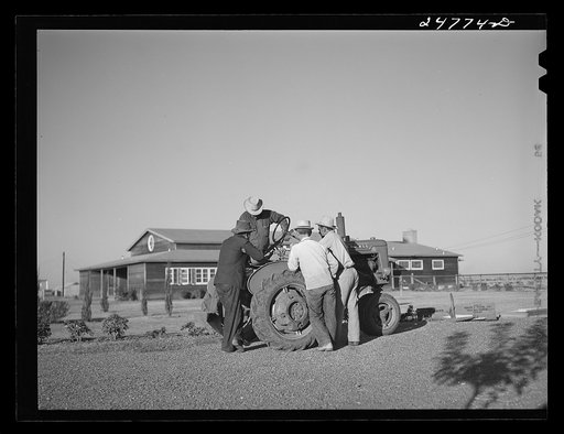 Campers with tractor used in community garden. Robstown FSA (Farm Security Administration) camp, Texas