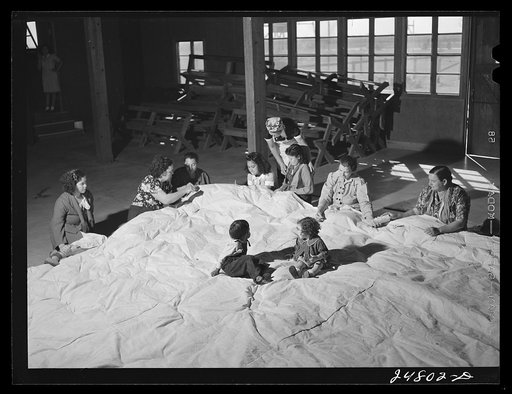Untitled photo, possibly related to: Women's committee works on mat for athletics. FSA (Farm Security Administration) camp, Robstown, Texas