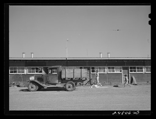 Truck parked in front of shelter. FSA (Farm Security Administration) camp, Robstown, Texas