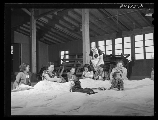 Women's committee works on mat for athletics. FSA (Farm Security Administration) camp, Robstown, Texas