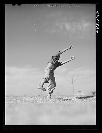 Untitled photo, possibly related to: Flying model airplane. FSA (Farm Security Administration) camp, Robstown, Texas