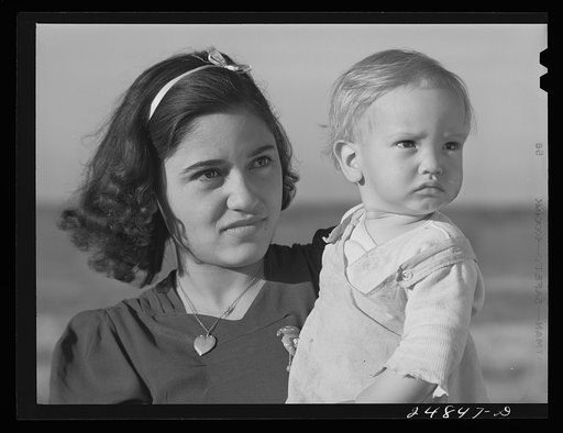 Migratory worker's wife and child. FSA (Farm Security Administration) camp, Robstown, Texas