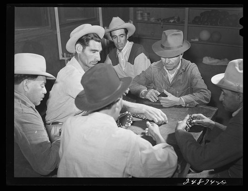 Domino game on Saturday night. Community center. Robstown camp, Texas