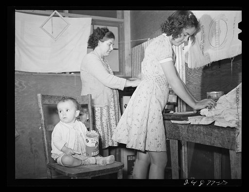 Untitled photo, possibly related to: Family preparing tortillas for supper. Robstown camp, Texas