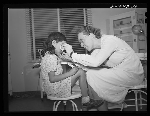 Nurse Doris Dill with young patient. Robstown, Texas