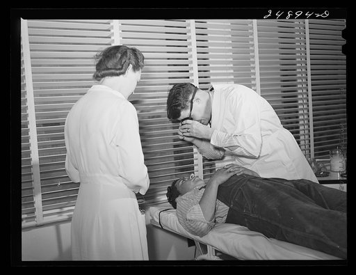 Doctor examining patient. Robstown FSA (Farm Security Administration) camp, Texas