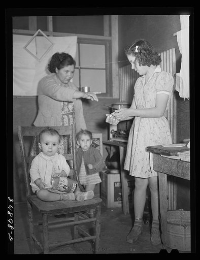 Untitled photo, possibly related to: Family preparing tortillas for supper. Robstown camp, Texas