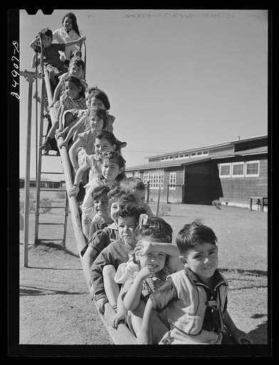 Nursery school children in playground. Robstown camp, Texas