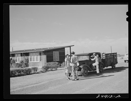 Camp manager says good-bye to family leaving camp. Robstown FSA (Farm Security Administration) camp, Texas