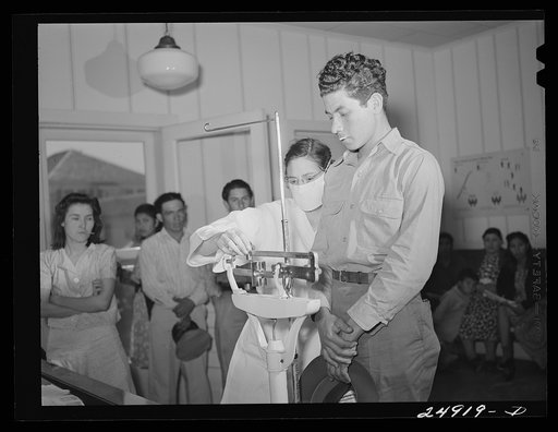 Corpus Christi, Texas. Privately supported tuberculosis clinic supervised by a retired doctor. Majority of patients are Latin-American. Patient on scale