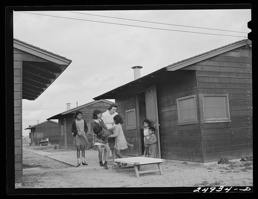 Harlingen, Texas. FSA (Farm Security Administration) camp. Nurse taking a boy with a fractured leg out for air