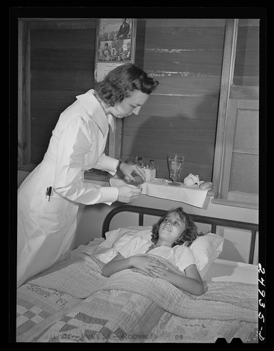 Harlingen, Texas. FSA (Farm Security Administration) camp. Nurse on home visit to child recovering from pneumonia