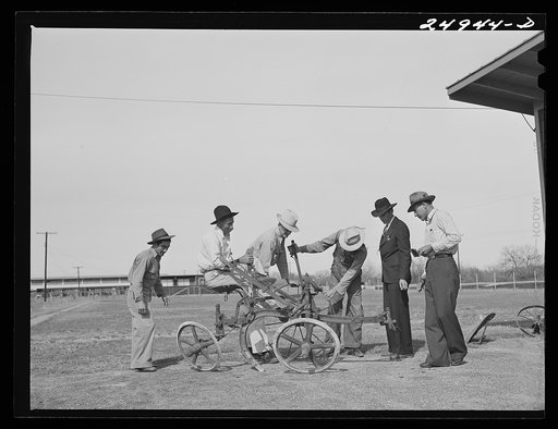 Sinton, Texas. FSA (Farm Security Administration) camp. Community council examines new plow for use in community gardens
