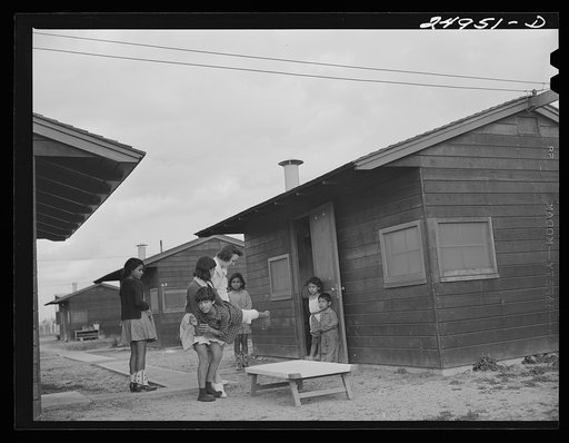 Untitled photo, possibly related to: Harlingen, Texas. FSA (Farm Security Administration) camp. Nurse taking a boy with a fractured leg out for air