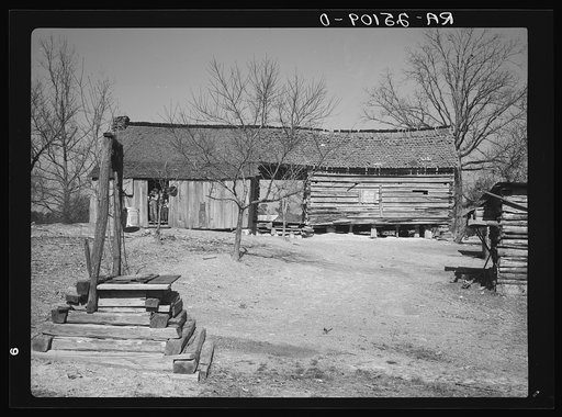 Dog-run log cabin in which Joe Handley, tenant farmer, lives. Walker County, Alabama