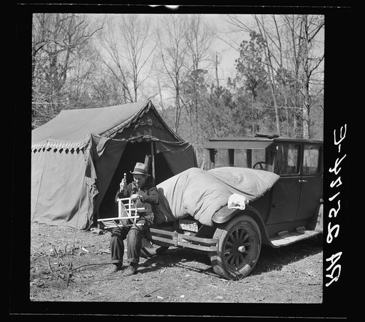 Making chairs to sell to tourists in a migrant camp on highway near Birmingham, Alabama