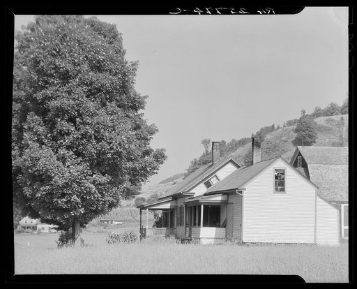 Farmhouse with slanting window. Windsor County, Vermont