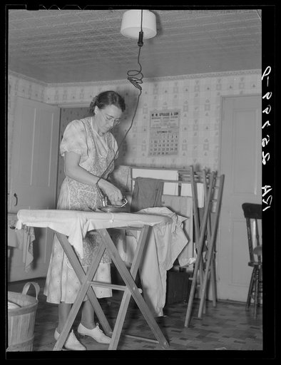 Hired girl ironing. McNally farm, Kirby, Vermont