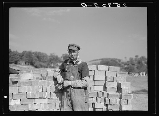 Member of Otsego Forest Products Cooperative working on the new modern sawmill. Cooperstown, New York