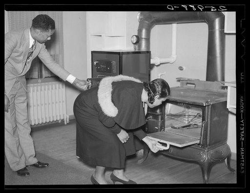 Inspecting furnace and stove. Newport News Homesteads, Virginia