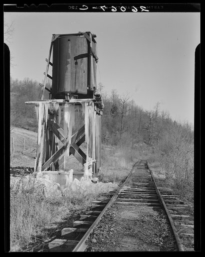 Water tower on railroad through Jennings, Maryland. The train now runs only once a week