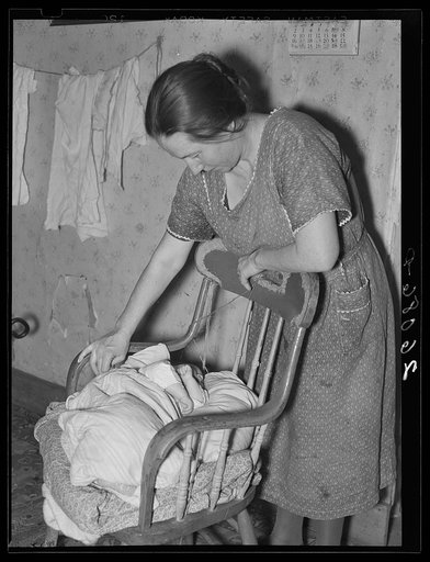 Mrs. Fred Stein, wife of farmer, cannot afford a cradle for her little girl. Garrett County, Maryland