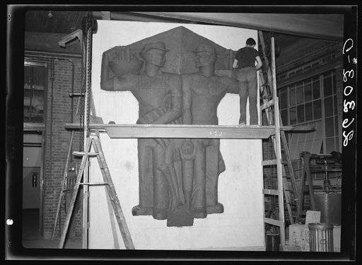Untitled photo, possibly related to: Washington, D.C. Vernon Atchely of the Special Skills division of the U.S. Resettlement Administration working on figures modeled in relief for the Greendale school