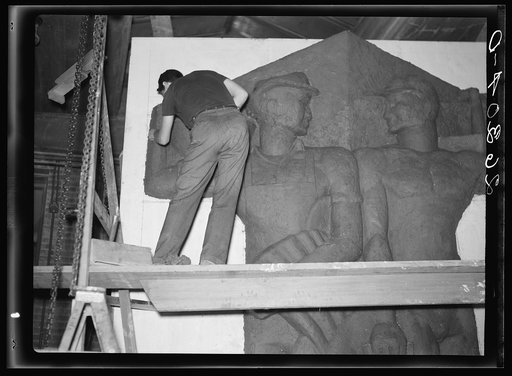 Untitled photo, possibly related to: Washington, D.C. Vernon Atchely of the Special Skills division of the U.S. Resettlement Administration working on figures modeled in relief for the Greendale school