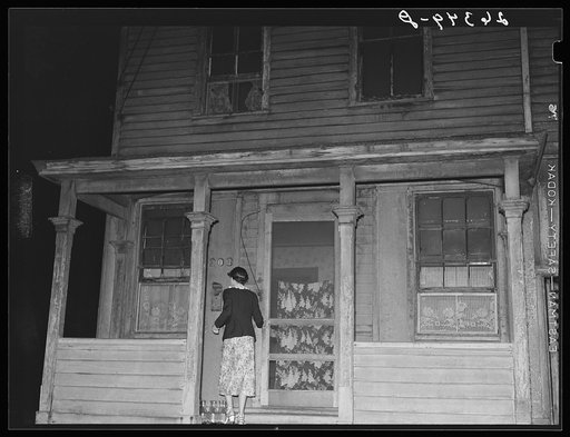 Prostitute entering house. Peoria, Illinois