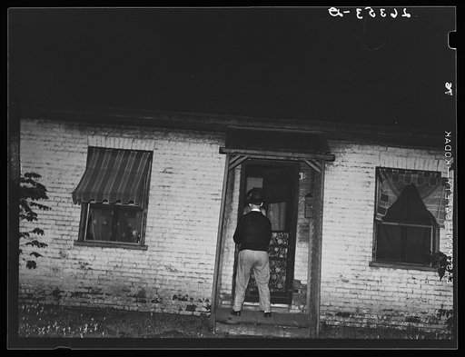 Man about to enter prostitute's house. Peoria, Illinois