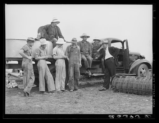 Members of the Wabash Farms cooperative discussing their work with the project manager