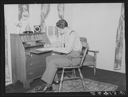 John Kindler, hotel clerk, in his home at Decatur Homesteads, Indiana