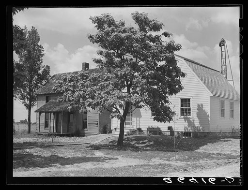 Old house being replaced by new farm unit. Scioto Farms, Ohio