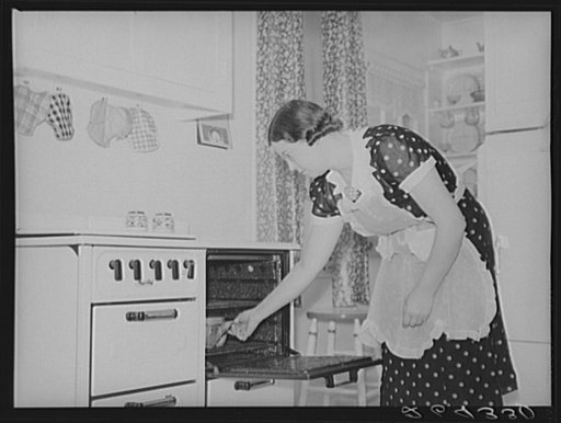 Mrs. Pingry in kitchen of her new home. Decatur Homesteads, Indiana