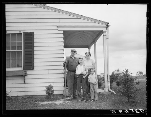 Untitled photo, possibly related to: The Bollinger family in front of their home. Decatur Homesteads, Indiana
