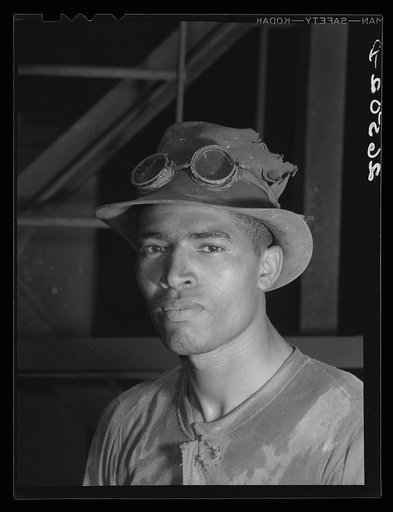 Steel worker in Pittsburgh steel mill. Pittsburgh, Pennsylvania