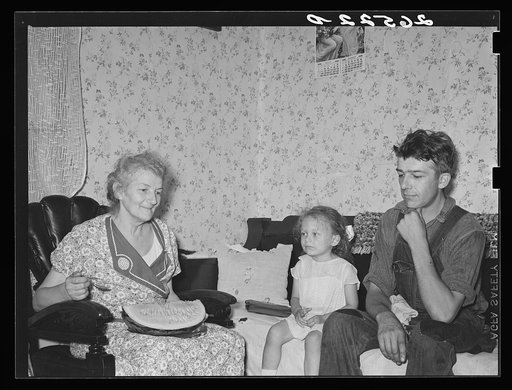 Steel worker with mother and daughter. Midland, Pennsylvania