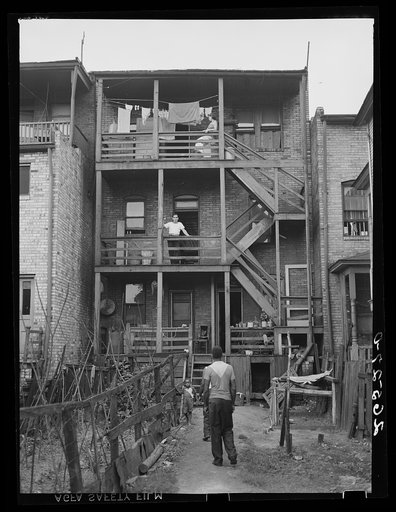 Slum tenant house in which both Negro and white families live. Midland, Pennsylvania