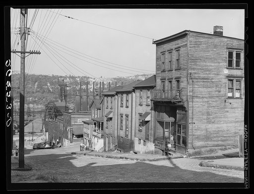 Workers' homes with steel plant along Monongahela River in background. Clairton, Pennsylvania