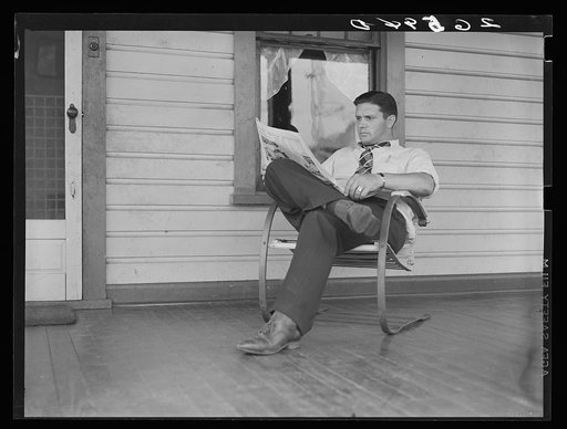 Clifford Shorts reading the evening paper. Aliquippa, Pennsylvania