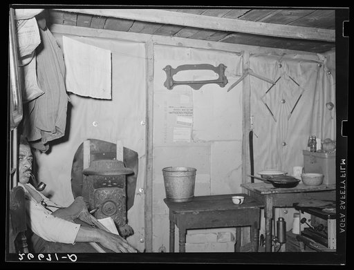 Untitled photo, possibly related to: Agricultural worker in one-room shack. Burlington County, New Jersey