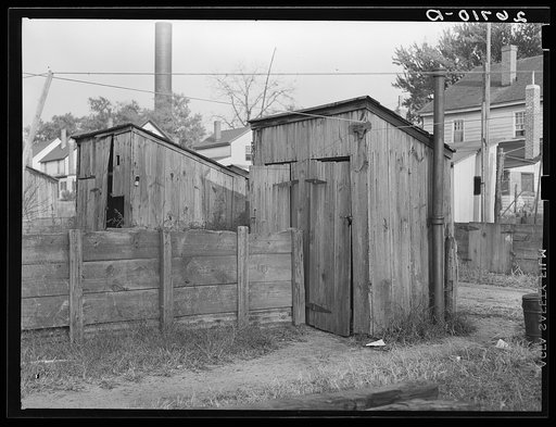 Toilets behind mill worker's houses. Millville, New Jersey