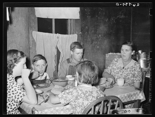 Untitled photo, possibly related to: WPA (Works Progress Administration) worker and family at dinner. Zeigler, Illinois