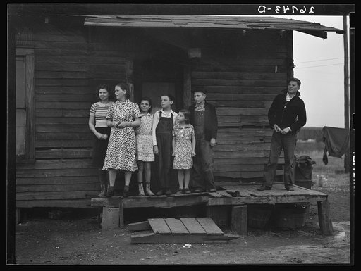 Untitled photo, possibly related to: Miner's children on porch of their home. Zeigler, Illinois