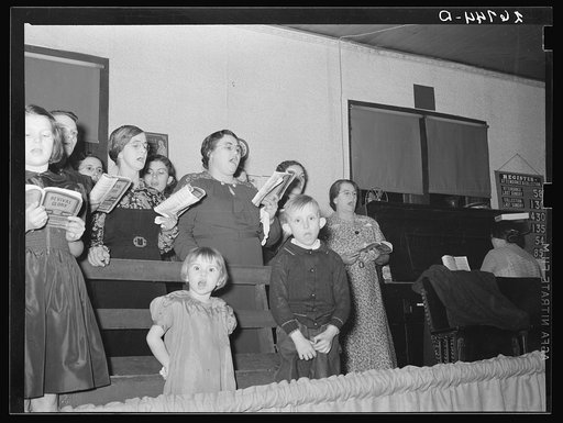 Choir singing at revival meeting in Pentecostal church. Cambria, Illinois