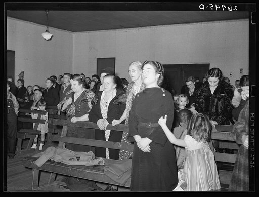 Praying during revival meeting. Pentecostal church, Cambria, Illinois